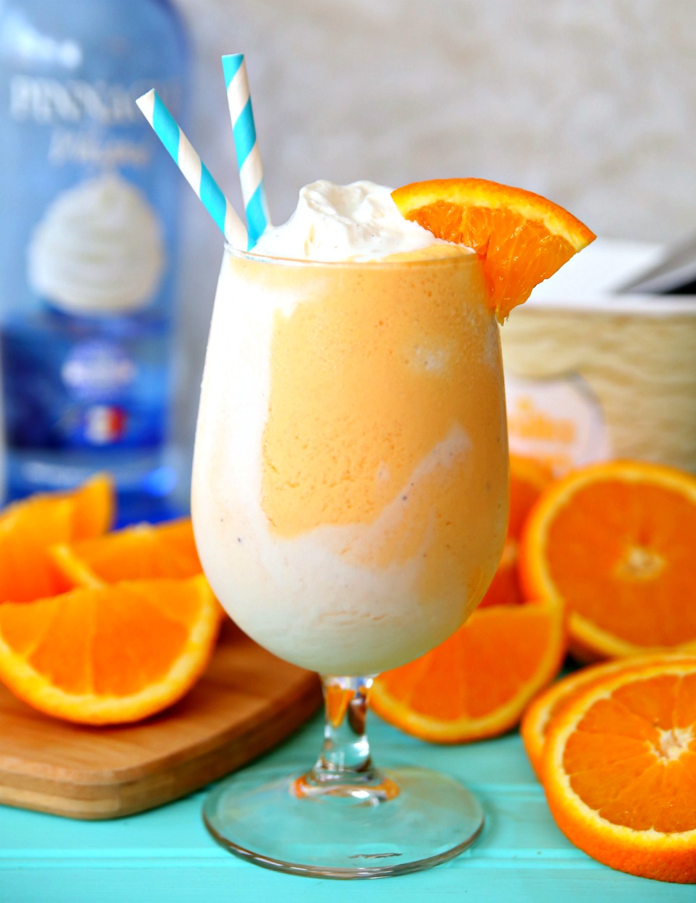 Boozy Orange Creamsicle Float recipe with orange soda, whipped cream vodka, and vanilla ice cream.