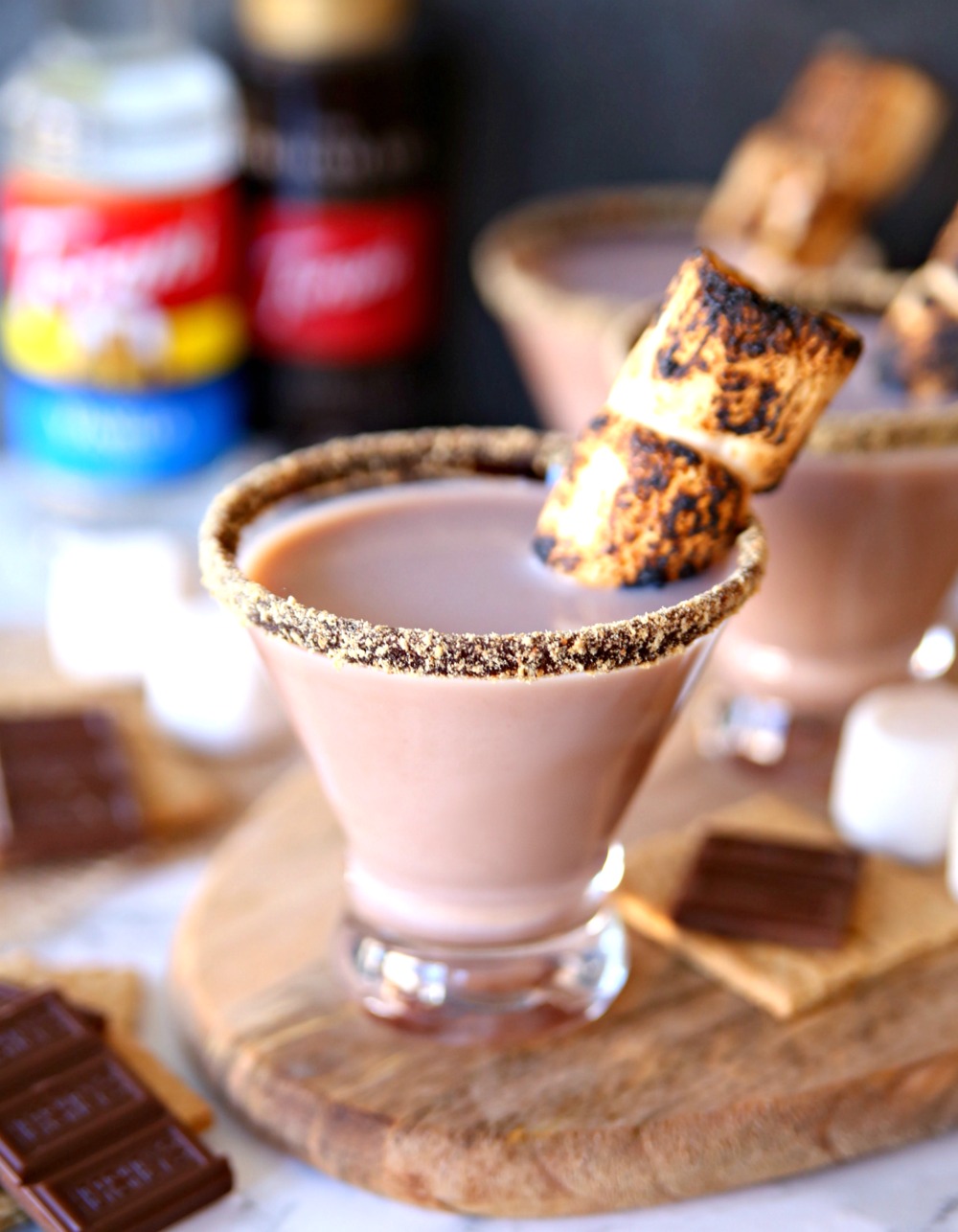 Toasted S'mores Martini Cocktail Recipe with toasted marshmallows, chocolate liquor, and crushed graham crackers.