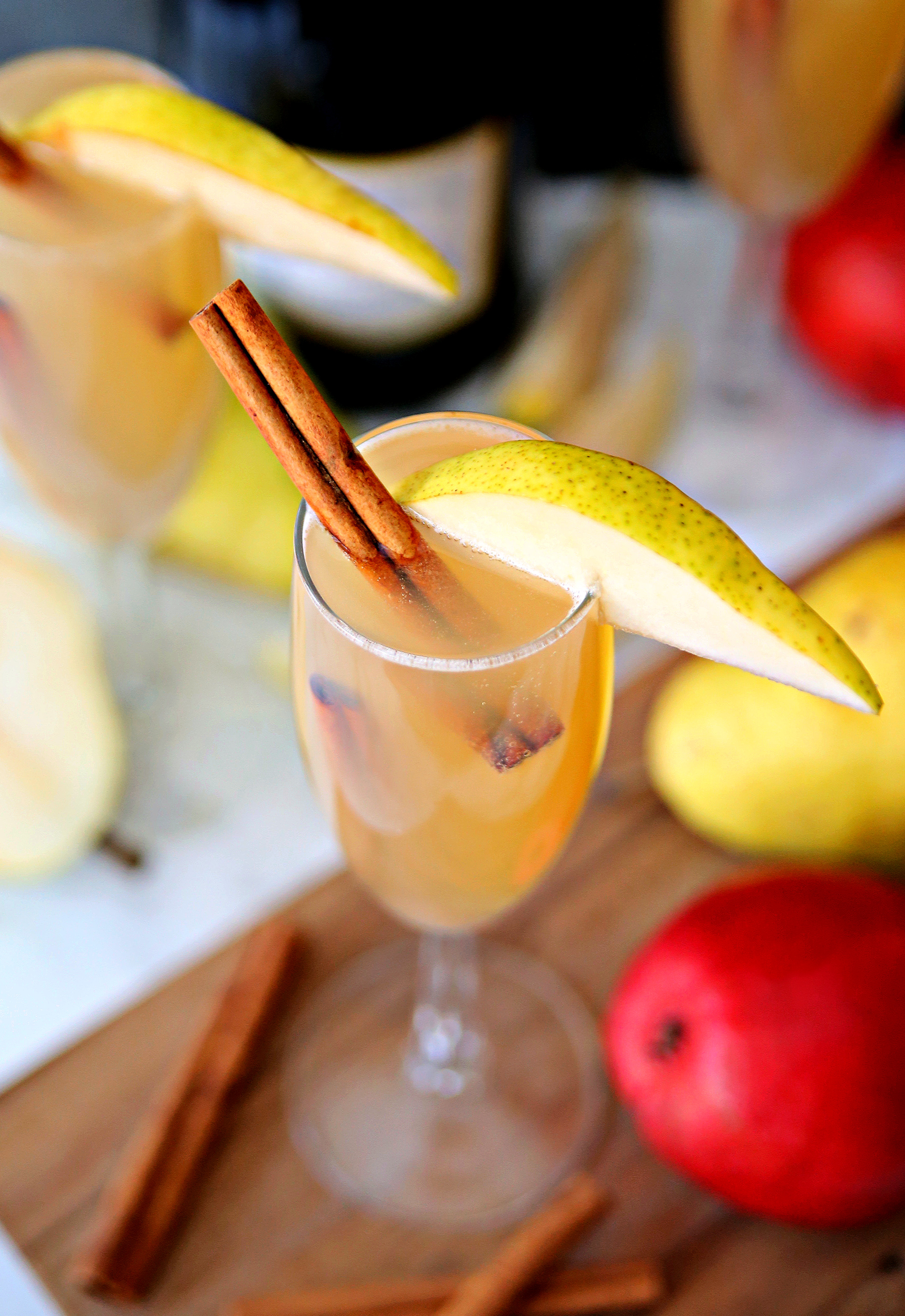 Celebrate the cooler weather with these Spiced Pear Bellinis. A delicious cocktail full of pear juice, Prosecco and fall spices.
