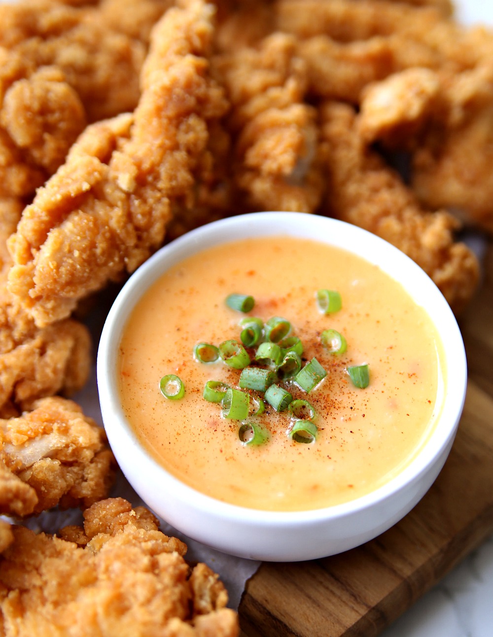 Bang Bang Sauce in bowl with Chicken Tenders