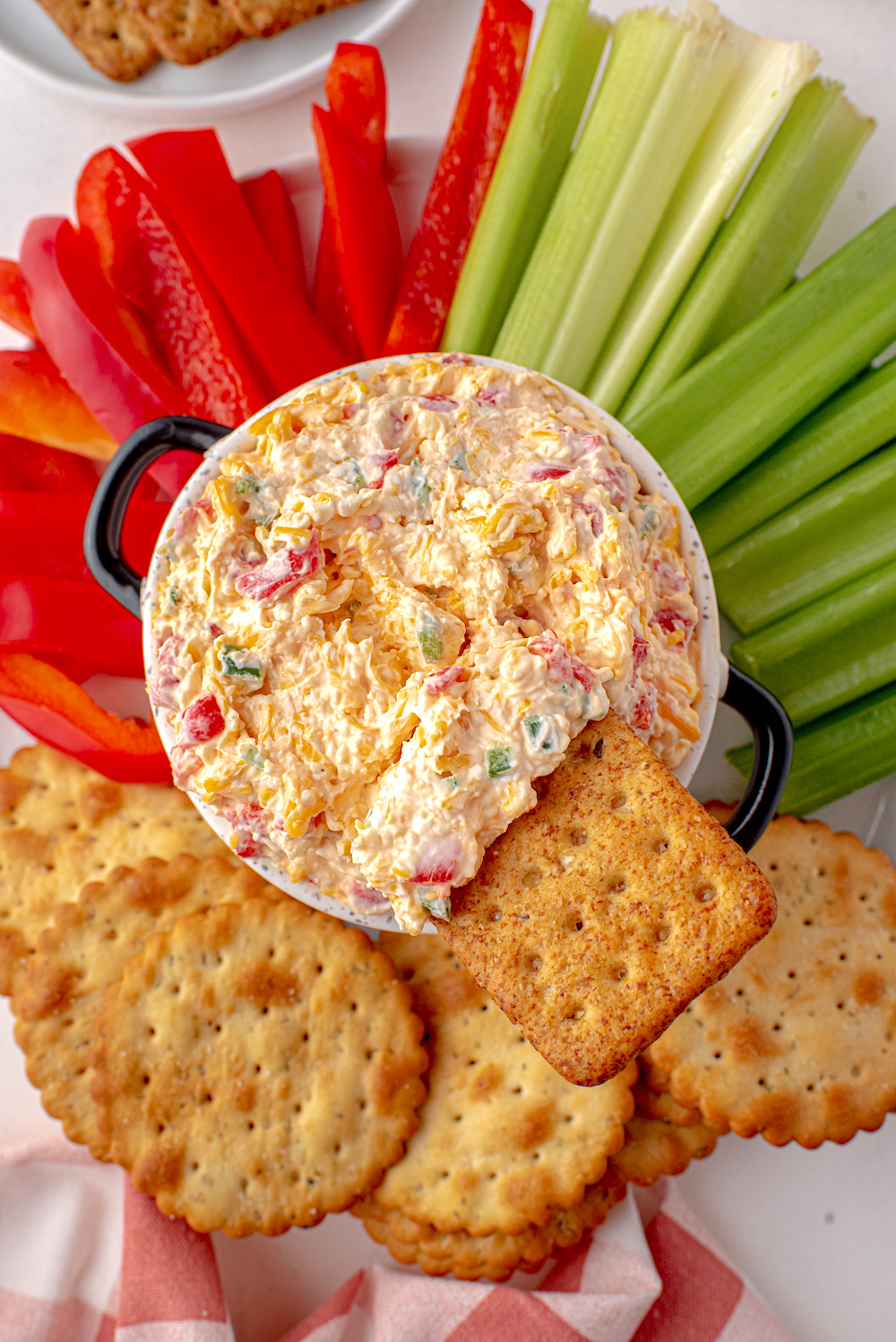 Jalapeno Pimento Cheese Dip with crackers and vegetables