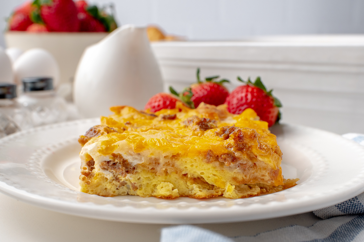 Breakfast Casserole with eggs, cheese, croissants and sausage gravy