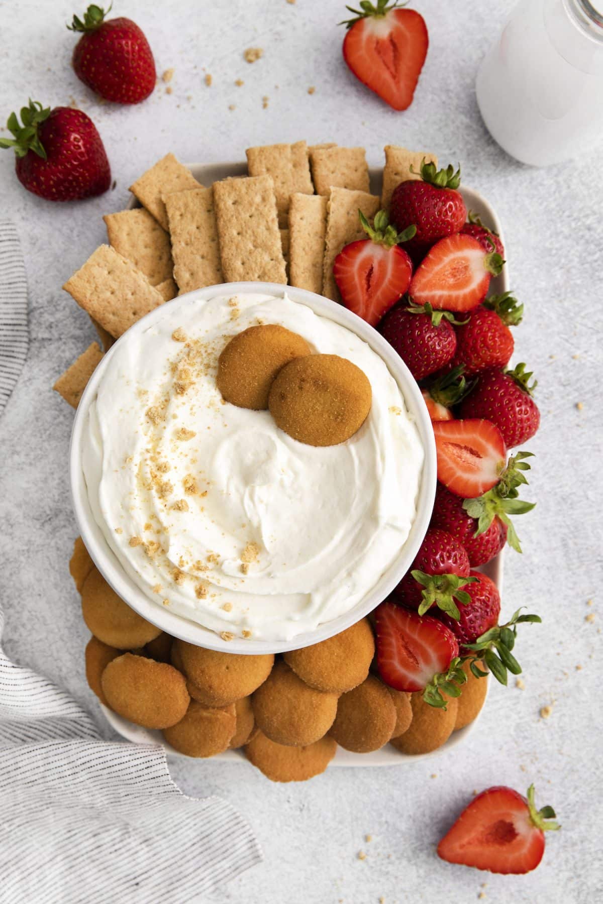 cheesecake dip with graham crackers and strawberries