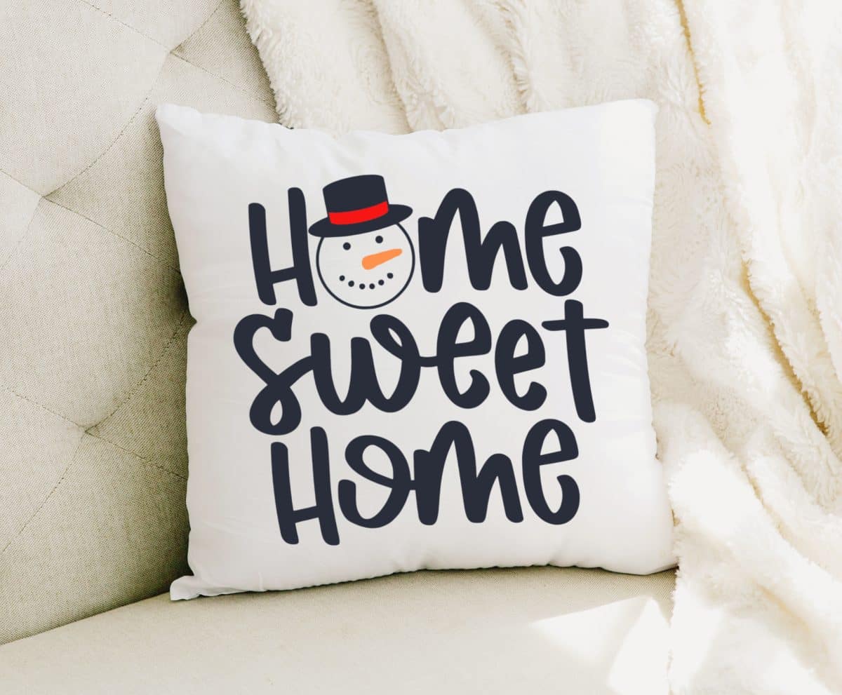 Home Sweet Home Snowman SVG on white pillow - Kara Creates