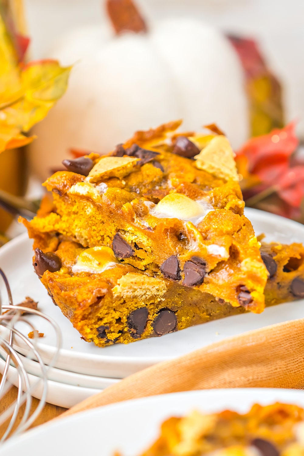 Homemade Pumpkin S’mores Cookie Cake with gooey marshmallows and chocolate pieces