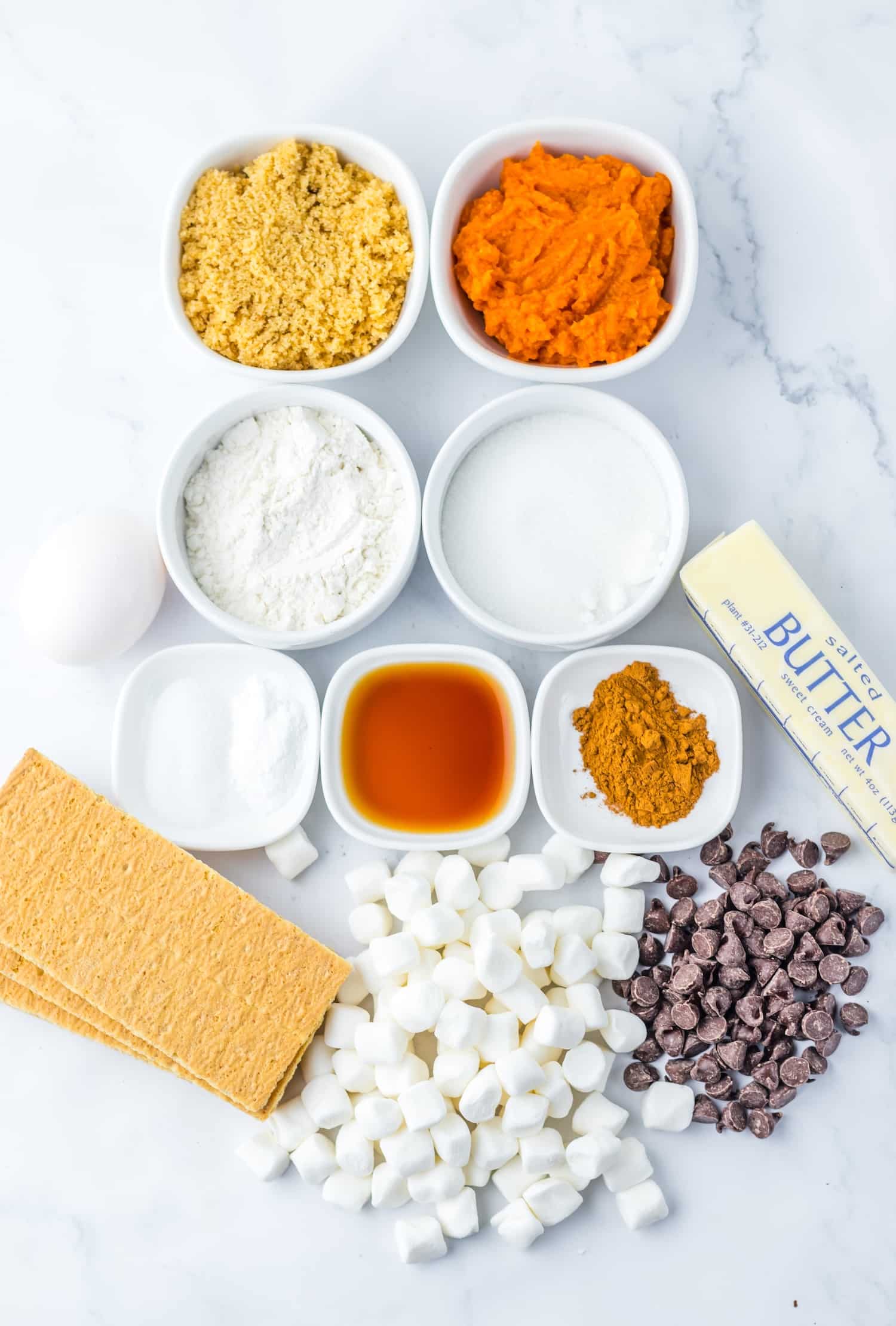Pumpkin S'mores Cookie Bars Ingredients on marble counter